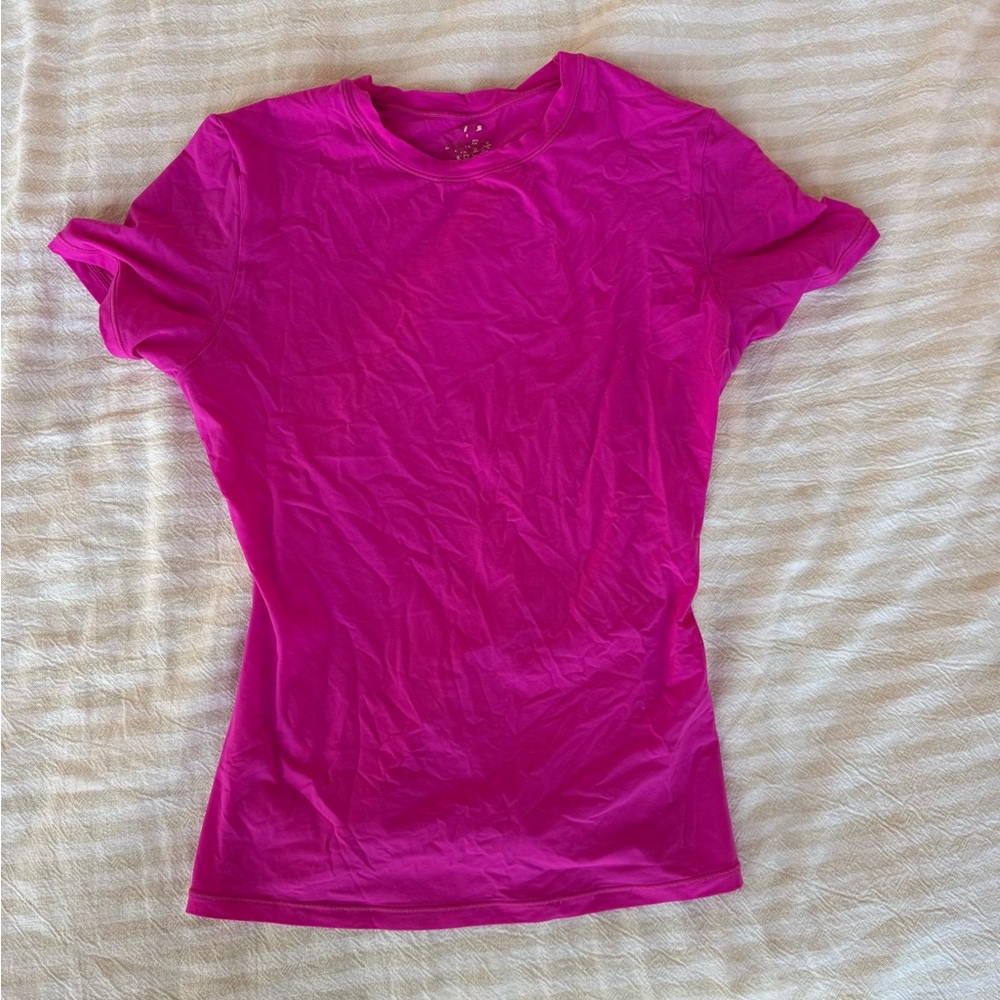 Skims bright pink shirt